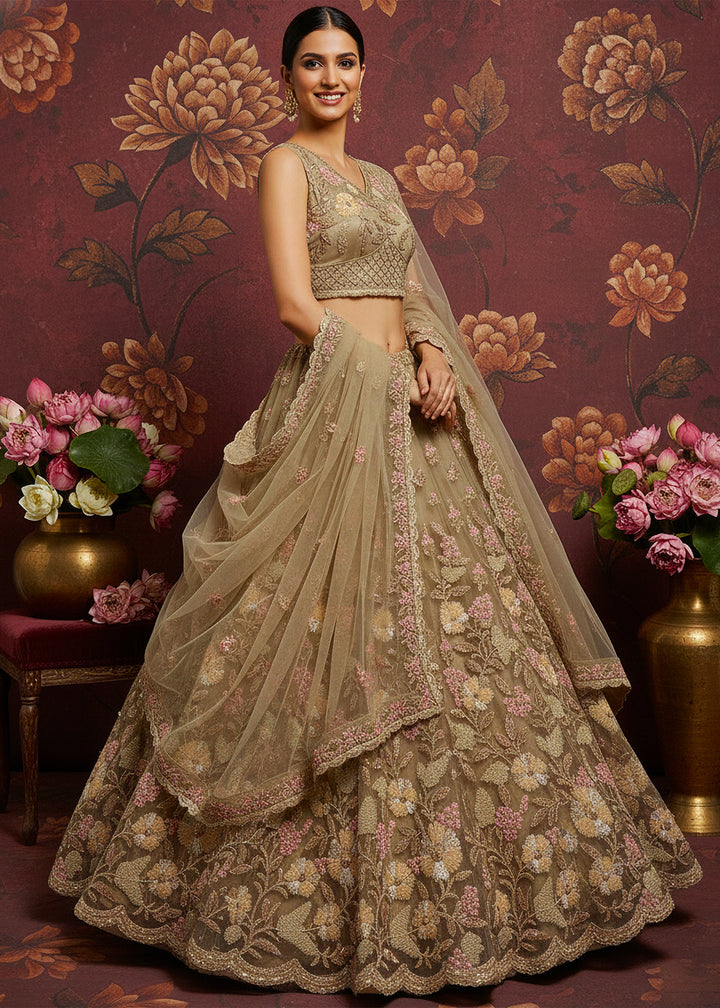 Buy Now Dusty Beige Heavy Net Bridal Wear Lehenga Online in US, UK, Canada, France, Germany, Sweden, Greece, Denmark, Spain, UAE, Africa & Worldwide at Empress.