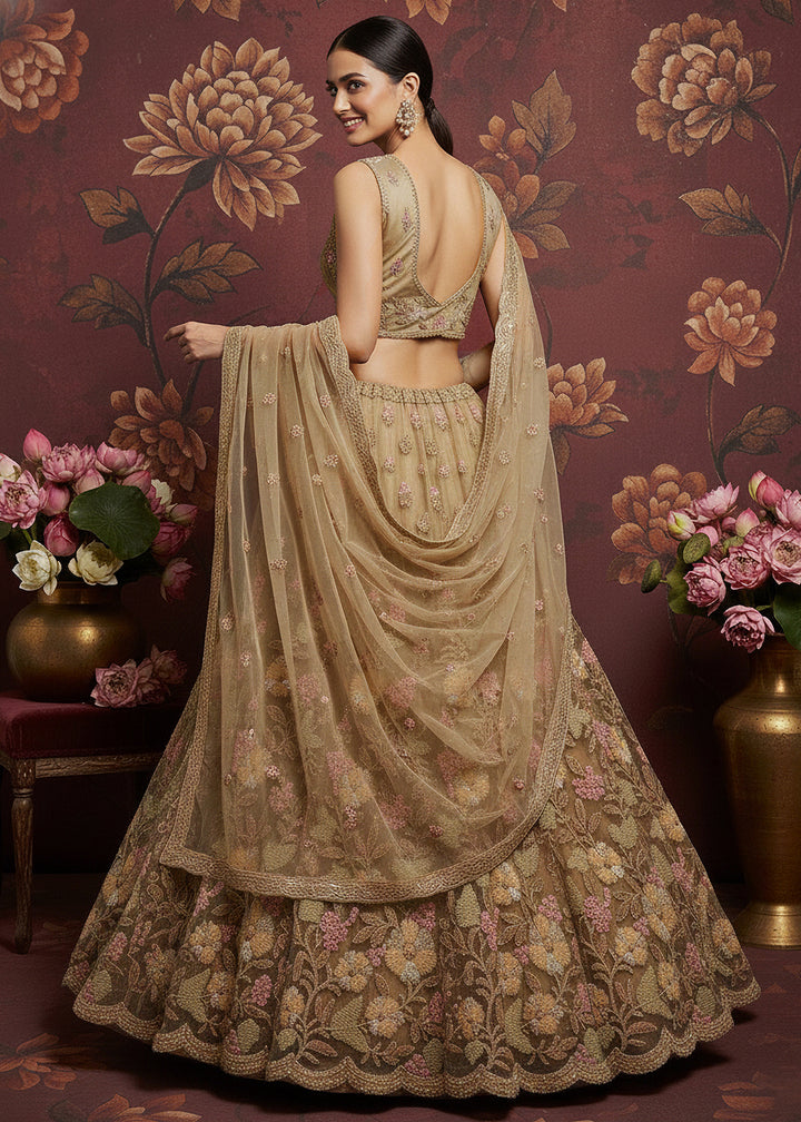 Buy Now Dusty Beige Heavy Net Bridal Wear Lehenga Online in US, UK, Canada, France, Germany, Sweden, Greece, Denmark, Spain, UAE, Africa & Worldwide at Empress.