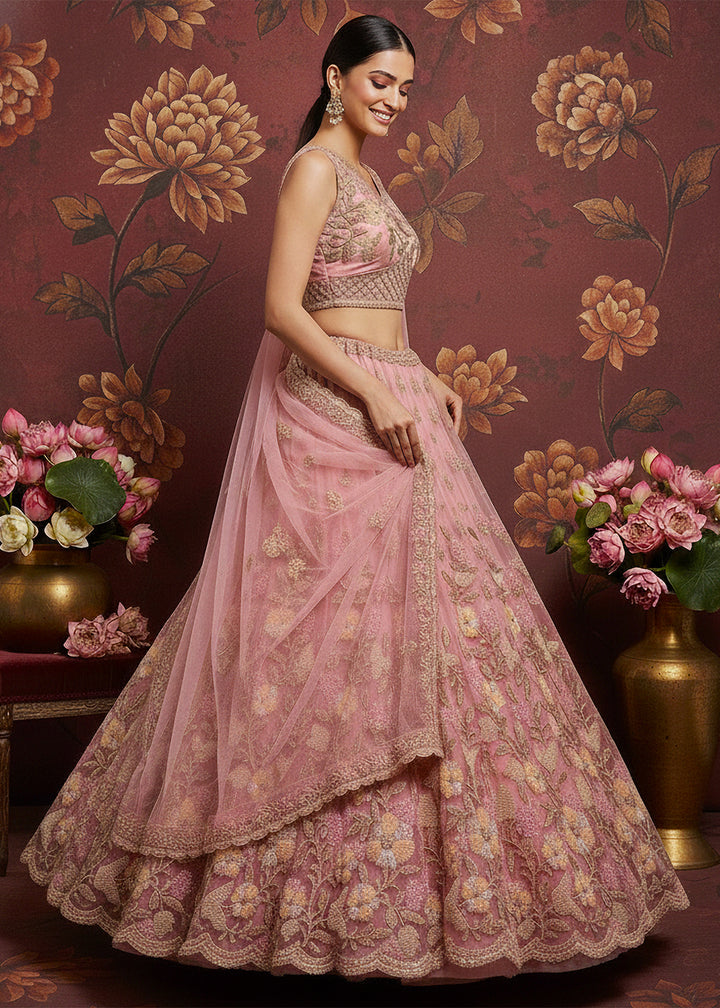 Buy Now Carnation Pink Heavy Net Bridal Wear Lehenga Online in US, UK, Canada, France, Germany, Sweden, Greece, Denmark, Spain, Africa & Worldwide at Empress.