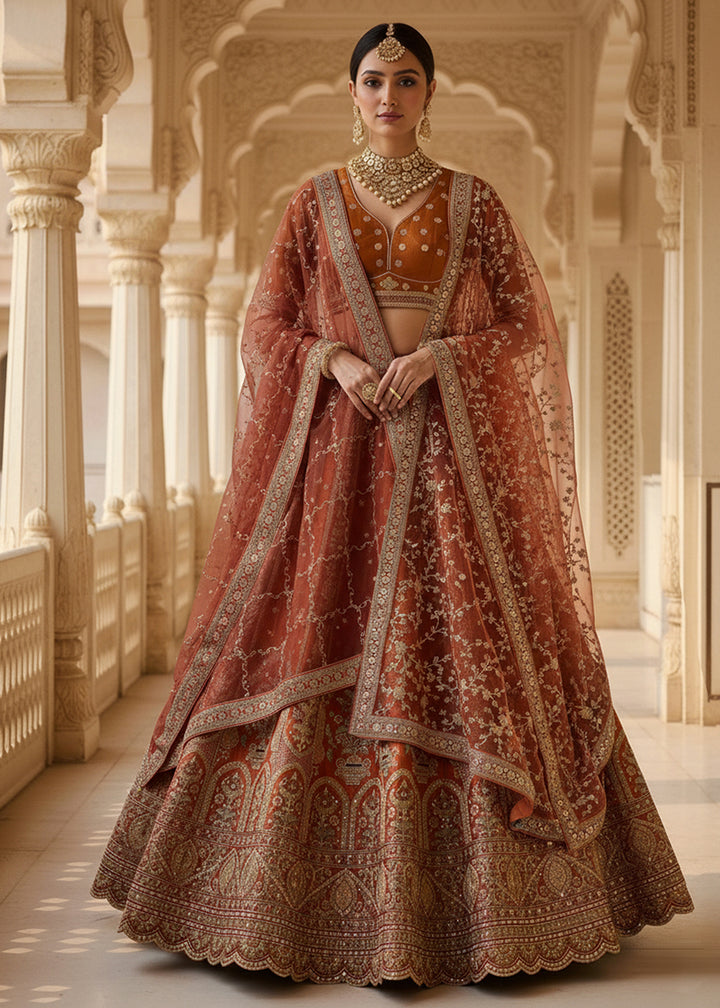 Buy Now Orange Ghadwal Silk Premium Embroidered Lehenga Online in US, UK, Canada, France, Germany, Sweden, Greece, Denmark, Spain, UAE & Worldwide at Empress.