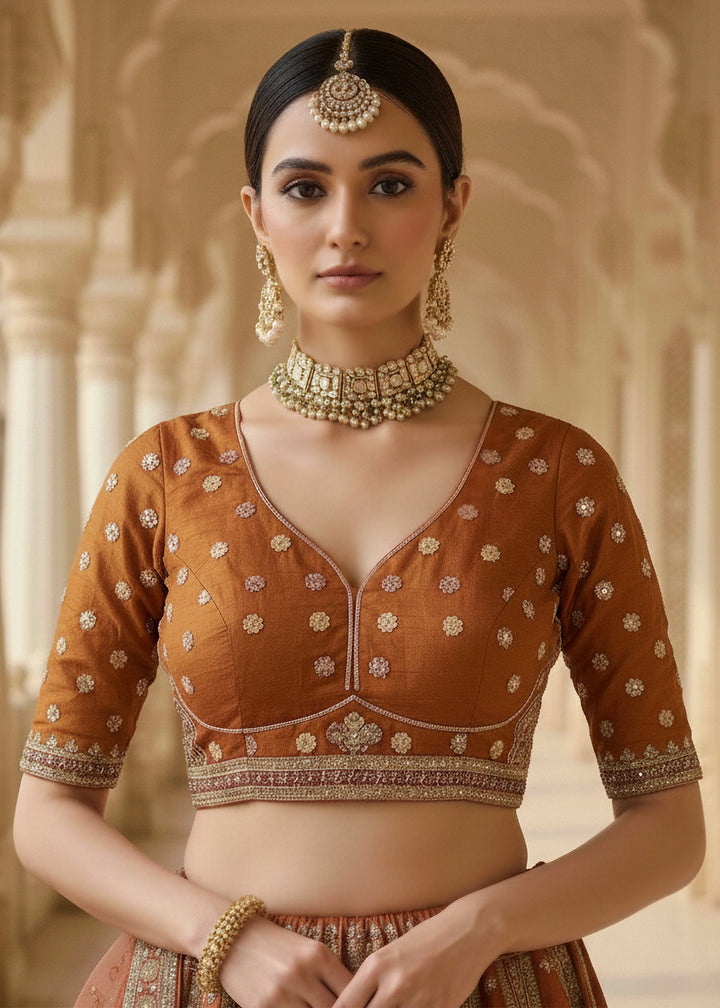 Buy Now Orange Ghadwal Silk Premium Embroidered Lehenga Online in US, UK, Canada, France, Germany, Sweden, Greece, Denmark, Spain, UAE & Worldwide at Empress.