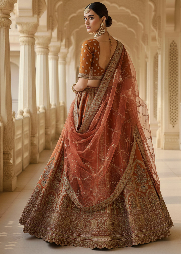 Buy Now Orange Ghadwal Silk Premium Embroidered Lehenga Online in US, UK, Canada, France, Germany, Sweden, Greece, Denmark, Spain, UAE & Worldwide at Empress.