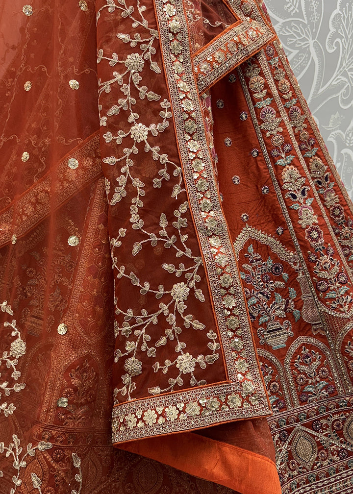 Buy Now Orange Ghadwal Silk Premium Embroidered Lehenga Online in US, UK, Canada, France, Germany, Sweden, Greece, Denmark, Spain, UAE & Worldwide at Empress.