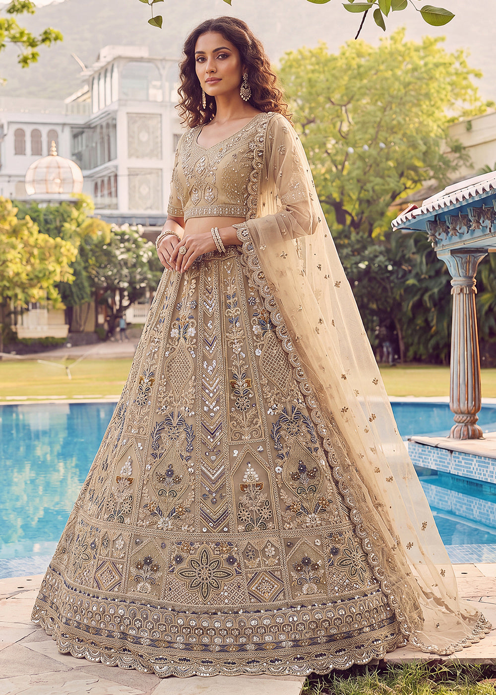 Buy Now Embroidered Dusty Gold Net Bridal Designer Lehenga Choli Online in US, UK, Canada, France, Italy, Germany, Sweden, UAE &amp; Worldwide at Empress Clothing.