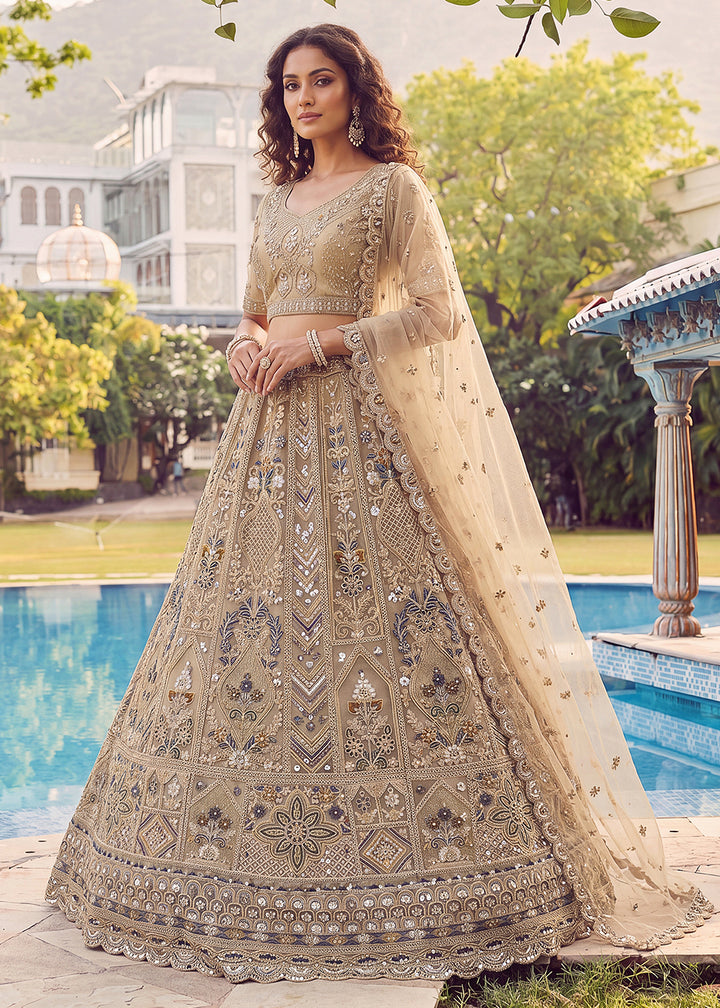 Buy Now Embroidered Dusty Gold Net Bridal Designer Lehenga Choli Online in US, UK, Canada, France, Italy, Germany, Sweden, UAE &amp; Worldwide at Empress Clothing.