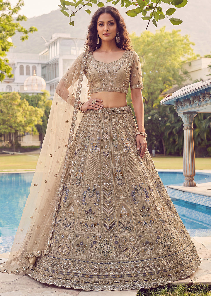 Buy Now Embroidered Dusty Gold Net Bridal Designer Lehenga Choli Online in US, UK, Canada, France, Italy, Germany, Sweden, UAE &amp; Worldwide at Empress Clothing.