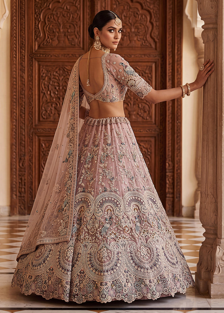 Buy Now Pink Heavy Embroidered Wedding Reception Lehenga Choli Online in US, UK, Canada, France, Italy, Germany, Sweden, UAE &amp; Worldwide at Empress Clothing.