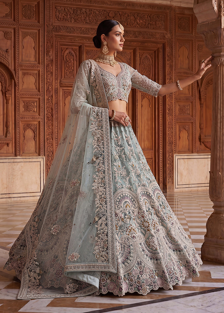 Buy Now Blue Heavy Embroidered Wedding Reception Lehenga Choli Online in US, UK, Canada, France, Italy, Germany, Sweden, UAE &amp; Worldwide at Empress Clothing.