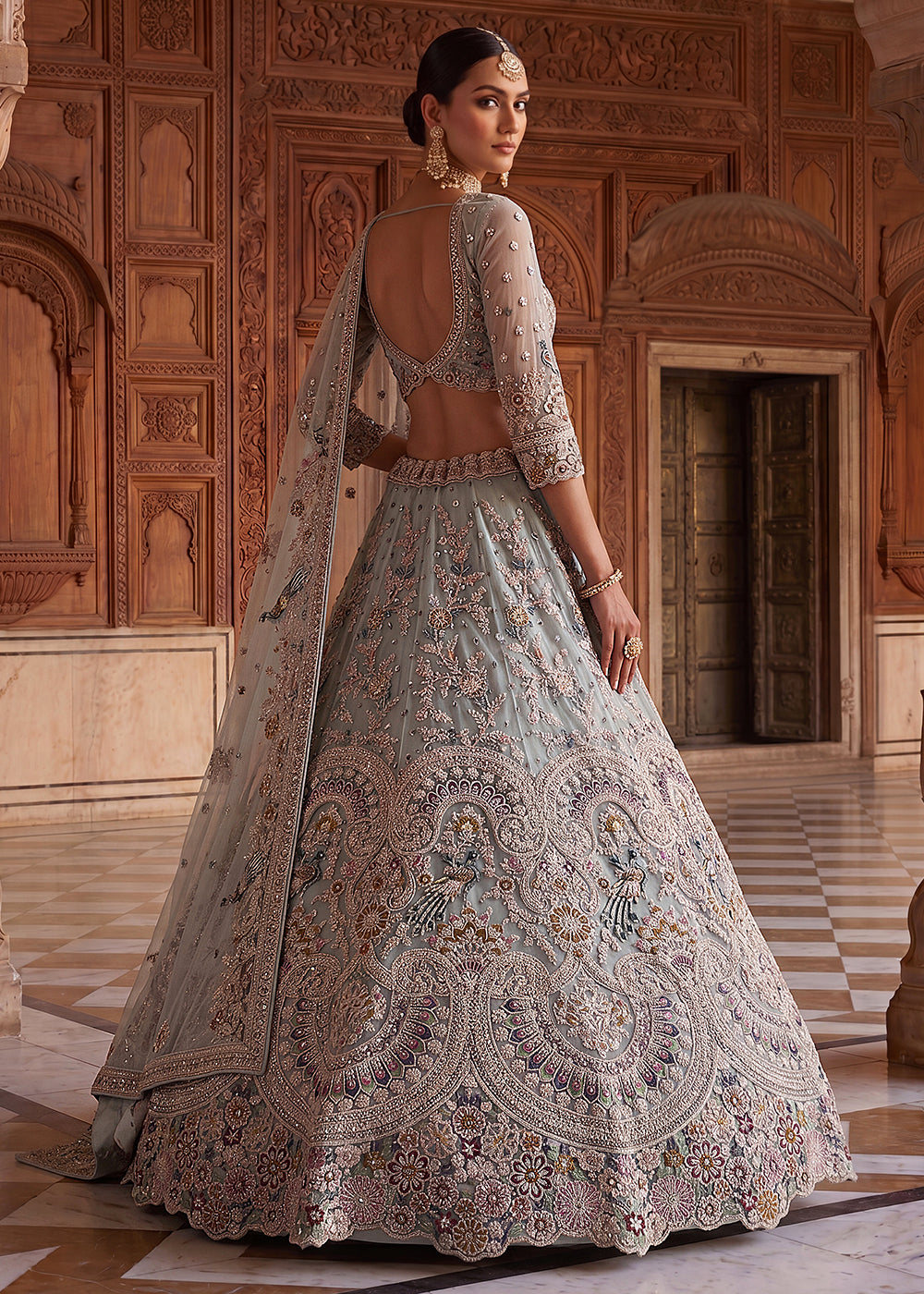 Buy Now Blue Heavy Embroidered Wedding Reception Lehenga Choli Online in US, UK, Canada, France, Italy, Germany, Sweden, UAE &amp; Worldwide at Empress Clothing.