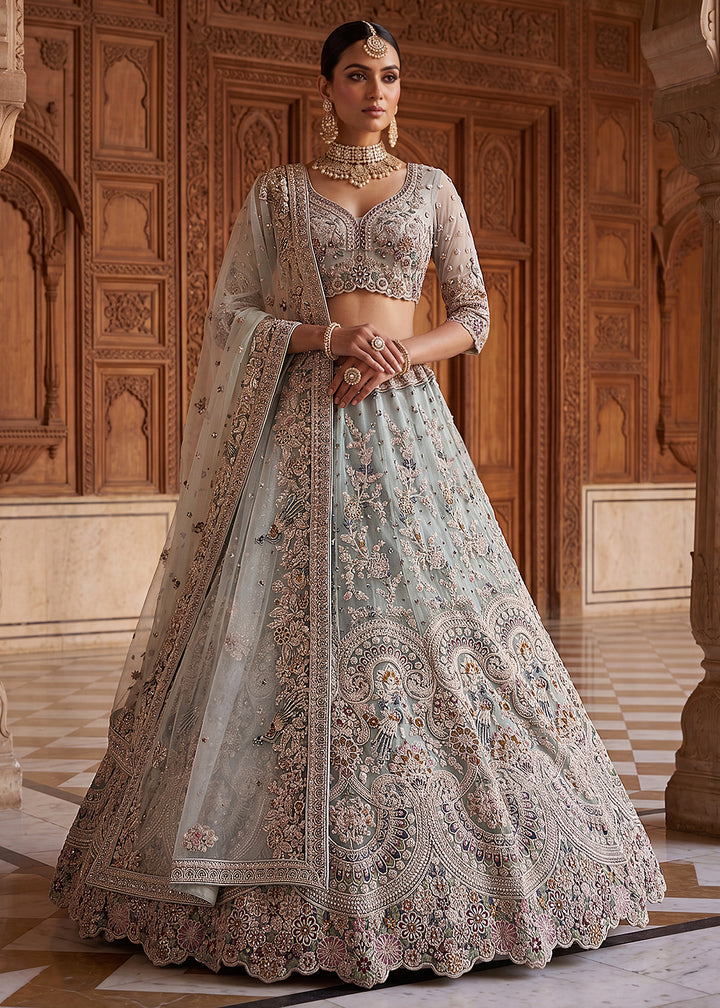 Buy Now Blue Heavy Embroidered Wedding Reception Lehenga Choli Online in US, UK, Canada, France, Italy, Germany, Sweden, UAE &amp; Worldwide at Empress Clothing.