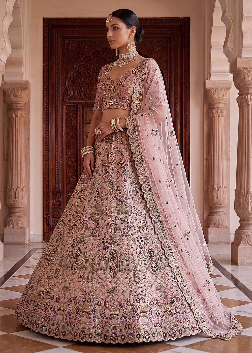 Buy Now Pink Heavy Embroidered Wedding Function Lehenga Choli Online in US, UK, Canada, France, Italy, Germany, Sweden, UAE &amp; Worldwide at Empress Clothing.