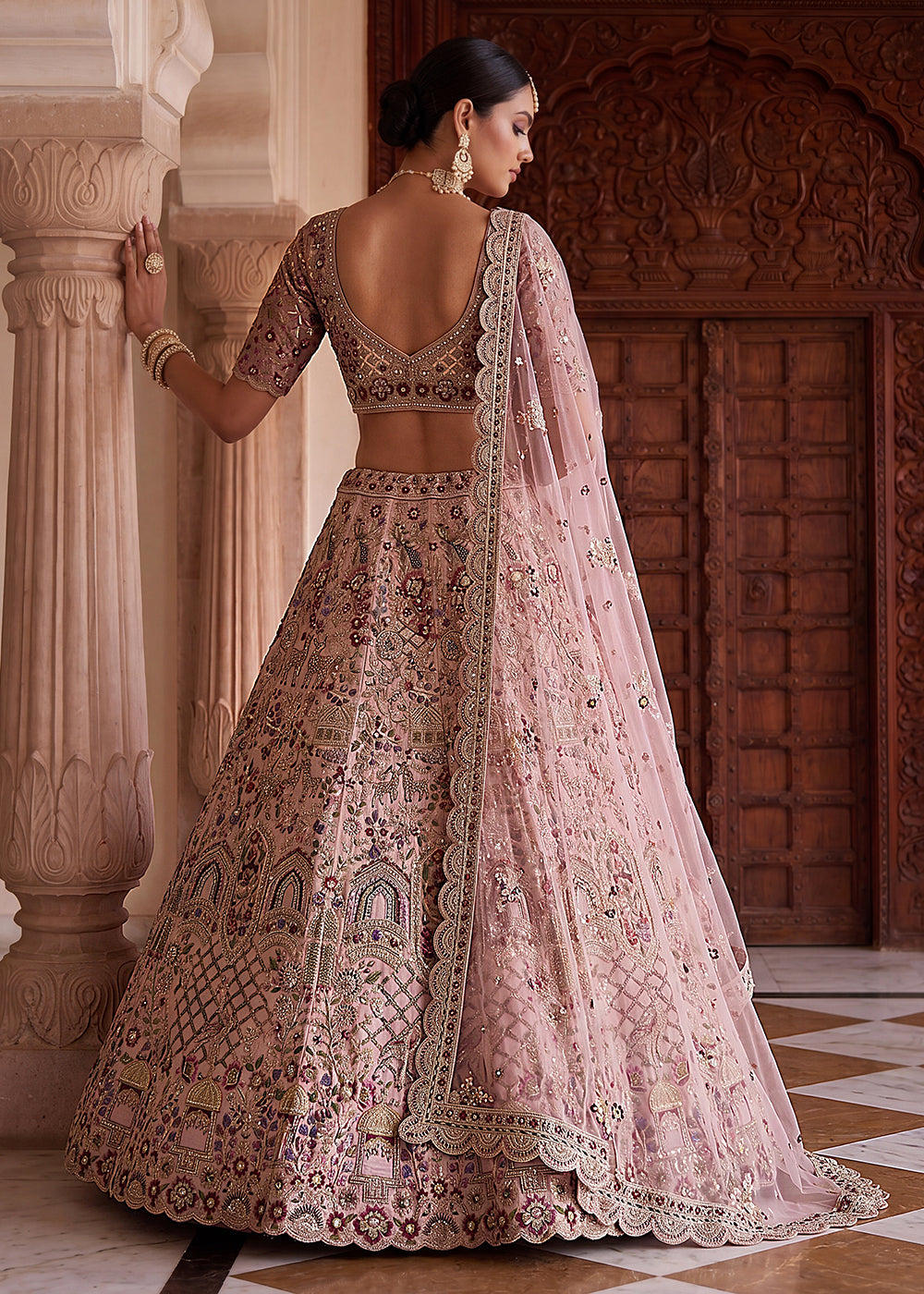 Buy Now Pink Heavy Embroidered Wedding Function Lehenga Choli Online in US, UK, Canada, France, Italy, Germany, Sweden, UAE &amp; Worldwide at Empress Clothing.