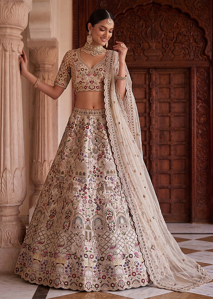 Buy Now Off White Heavy Embroidered Wedding Function Lehenga Choli Online in US, UK, Canada, France, Italy, Germany, Sweden, UAE &amp; Worldwide at Empress Clothing.