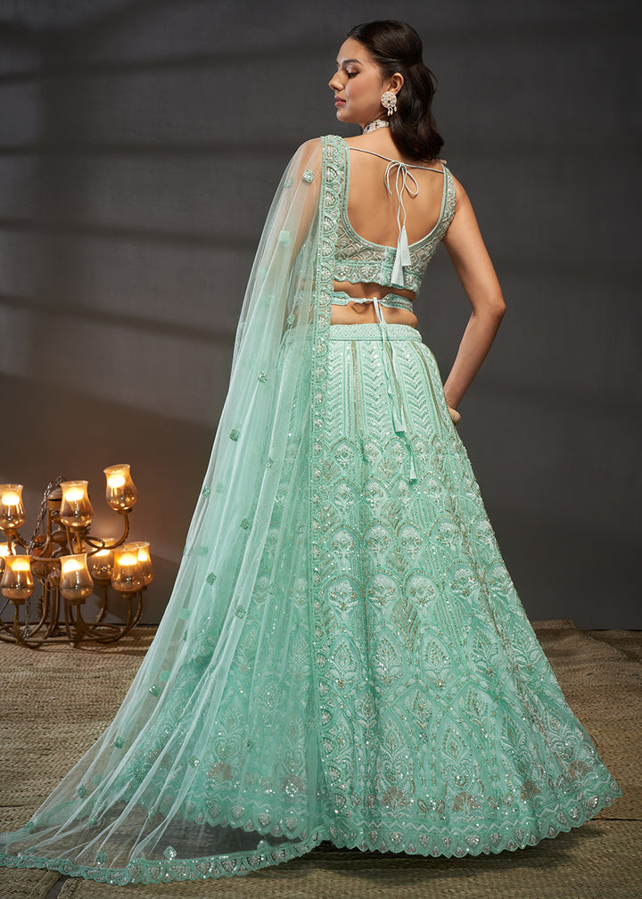 Buy Now Net Turquoise Heavy Embroidered Designer Bridal Lehenga Choli Online in USA, UK, Canada & Worldwide at Empress Clothing.