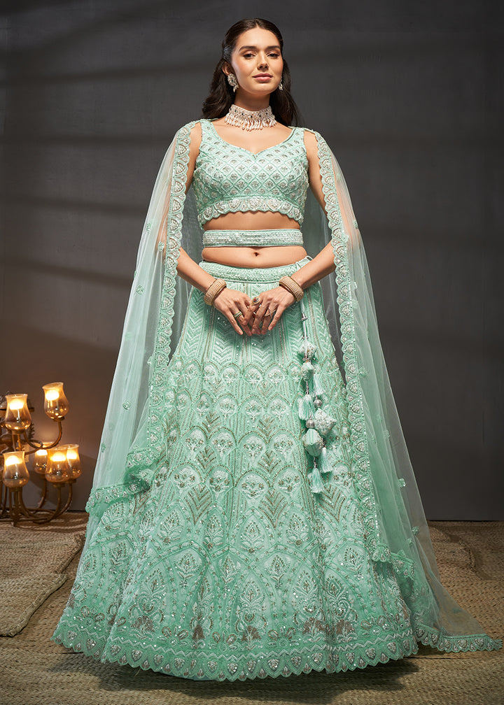 Buy Now Net Turquoise Heavy Embroidered Designer Bridal Lehenga Choli Online in USA, UK, Canada & Worldwide at Empress Clothing.