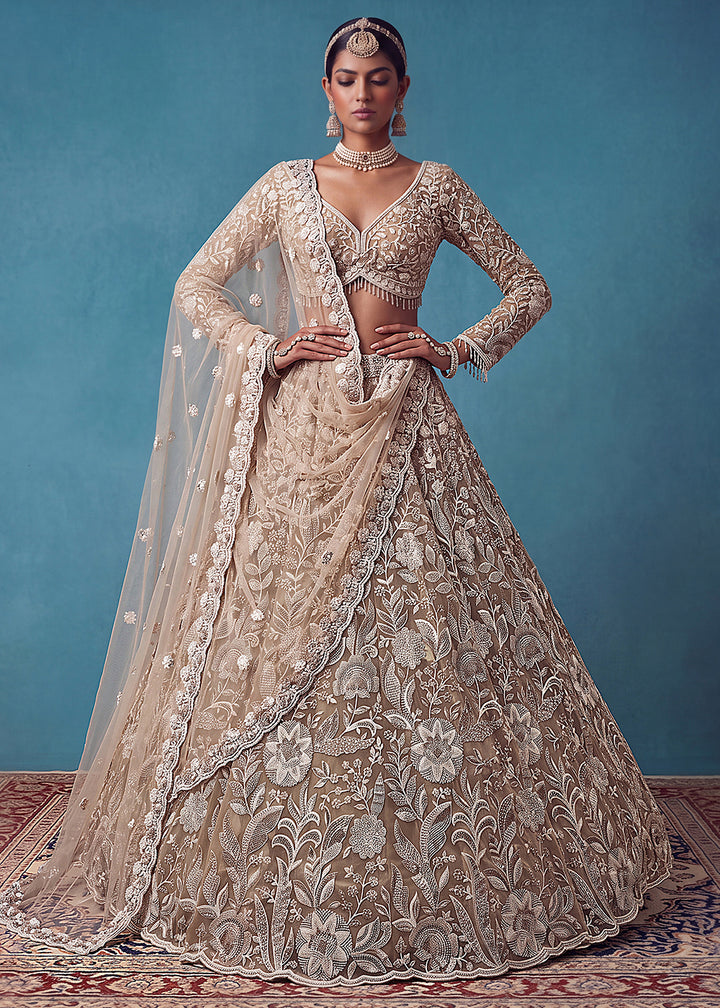 Buy Now Extraordinary Golden Flared Hand-Embroidered Lehenga Choli Online in US, UK, Canada, France, Italy, Germany, Sweden, Denmark &amp; Worldwide at Empress.