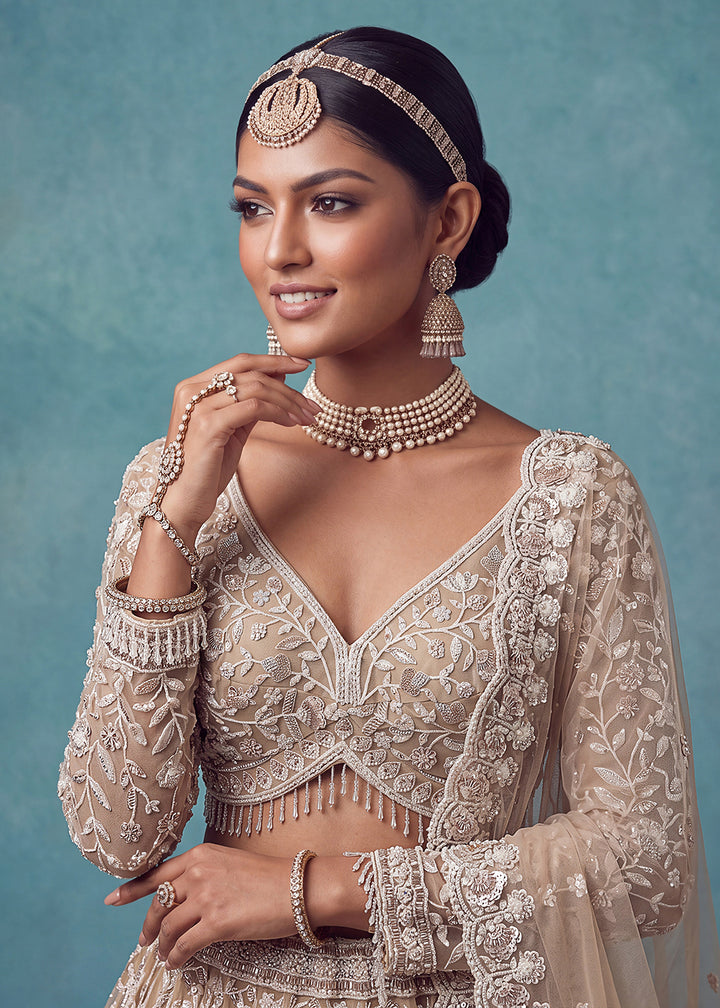 Buy Now Extraordinary Golden Flared Hand-Embroidered Lehenga Choli Online in US, UK, Canada, France, Italy, Germany, Sweden, Denmark &amp; Worldwide at Empress.