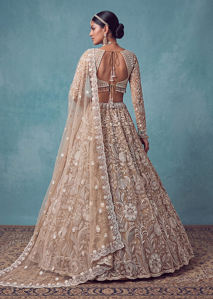 Buy Now Extraordinary Golden Flared Hand-Embroidered Lehenga Choli Online in US, UK, Canada, France, Italy, Germany, Sweden, Denmark &amp; Worldwide at Empress.