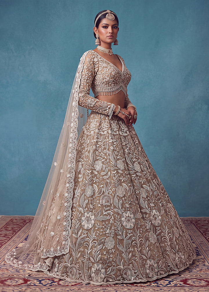 Buy Now Extraordinary Golden Flared Hand-Embroidered Lehenga Choli Online in US, UK, Canada, France, Italy, Germany, Sweden, Denmark &amp; Worldwide at Empress.