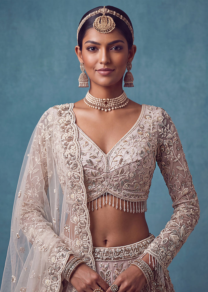 Buy Now Extraordinary Mauve Flared Hand-Embroidered Lehenga Choli Online in US, UK, Canada, France, Italy, Germany, Sweden, Denmark, UAE &amp; Worldwide at Empress.