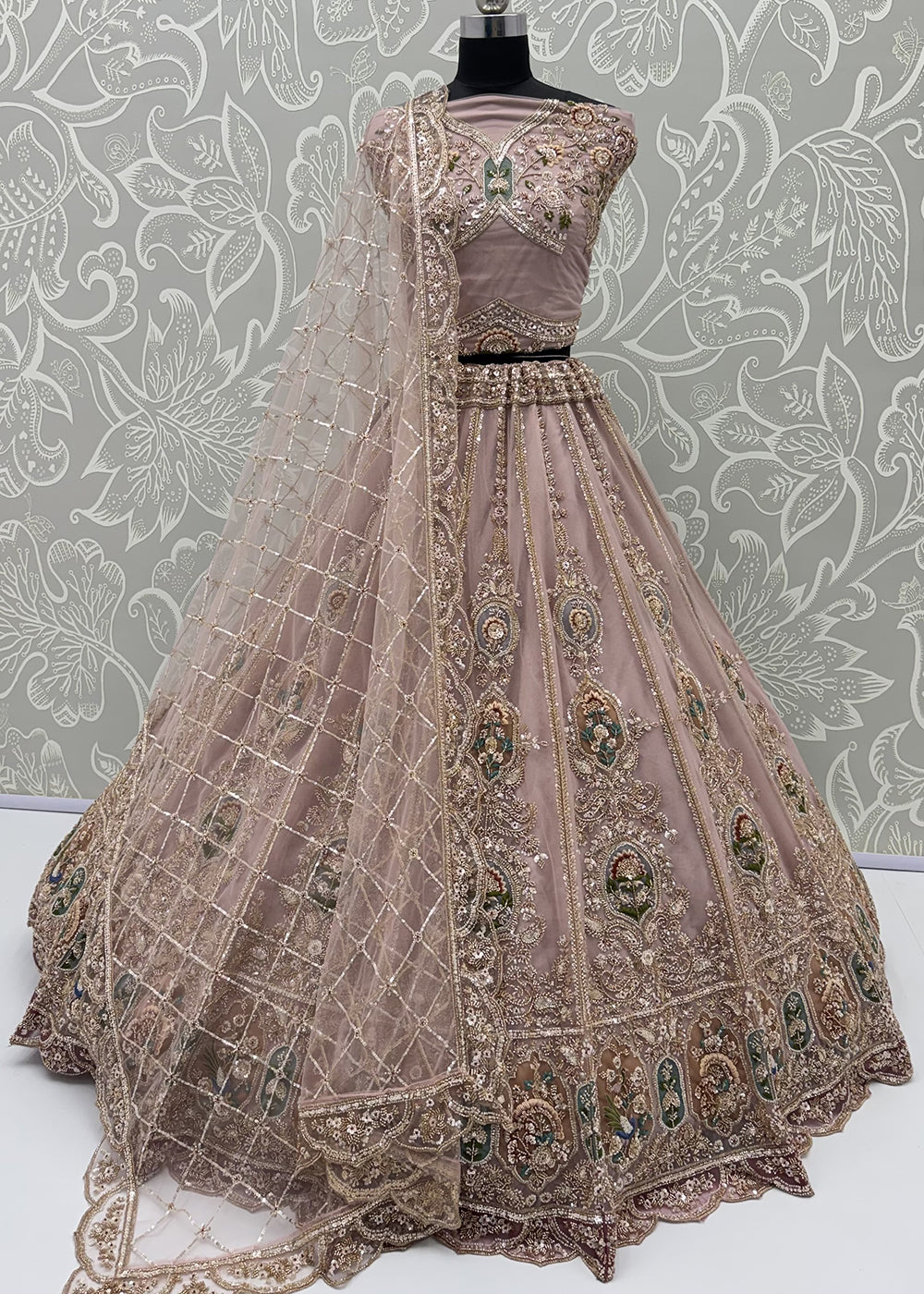 Buy Now Appealing Mauve Net Heavy Embroidered Bridal Lehenga Choli Online in US, UK, Canada, France, Italy, Germany, Sweden, Austria &amp; Worldwide at Empress.