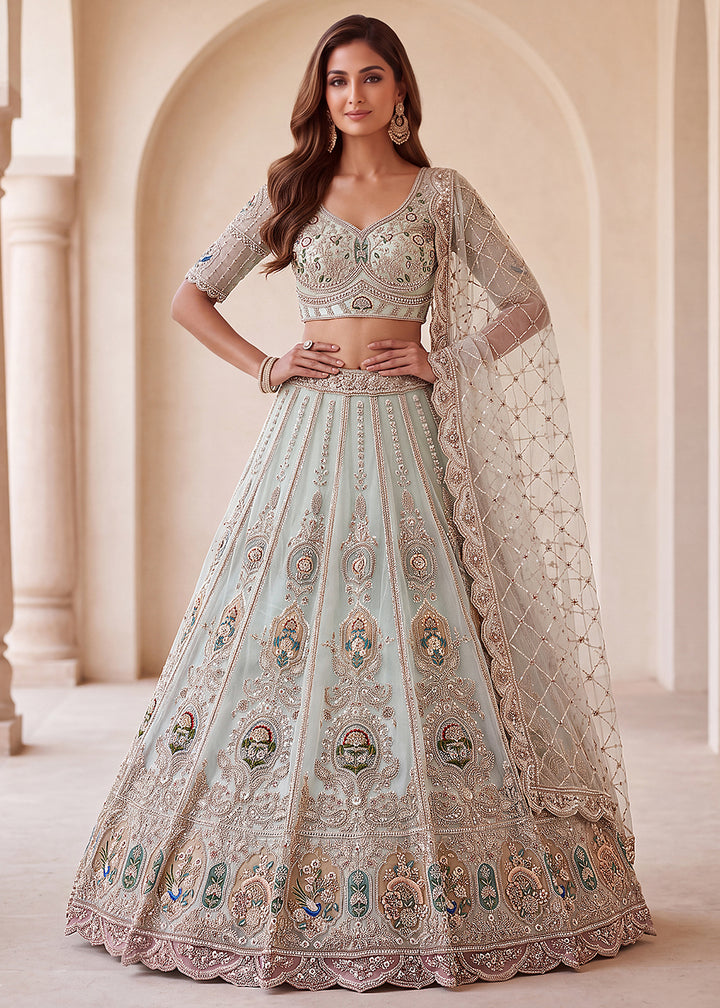 Buy Now Appealing Blue Net Heavy Embroidered Bridal Lehenga Choli Online in US, UK, Canada, France, Italy, Germany, Sweden, Austria, UAE &amp; Worldwide at Empress.