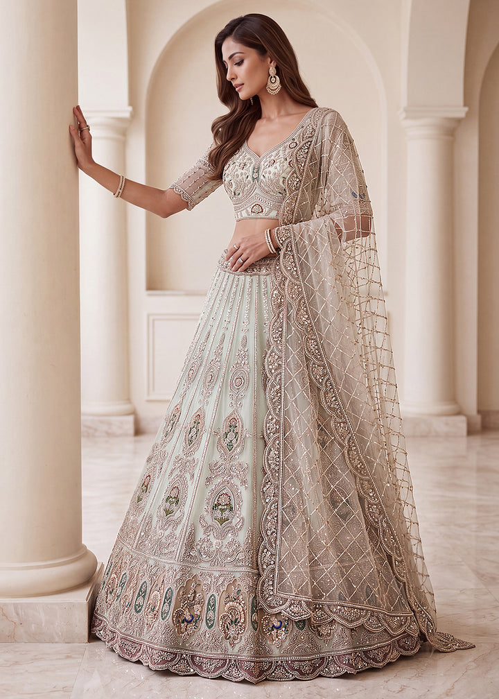 Buy Now Appealing Blue Net Heavy Embroidered Bridal Lehenga Choli Online in US, UK, Canada, France, Italy, Germany, Sweden, Austria, UAE &amp; Worldwide at Empress.