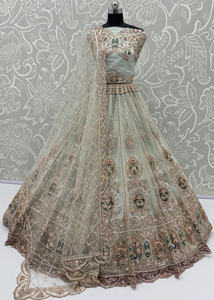 Buy Now Appealing Blue Net Heavy Embroidered Bridal Lehenga Choli Online in US, UK, Canada, France, Italy, Germany, Sweden, Austria, UAE &amp; Worldwide at Empress.