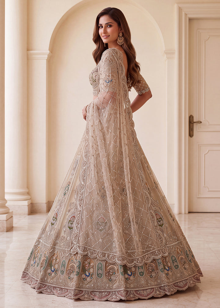 Buy Now Appealing Green Net Heavy Embroidered Bridal Lehenga Choli Online in US, UK, Canada, France, Italy, Germany, Sweden, Austria, UAE &amp; Worldwide at Empress.