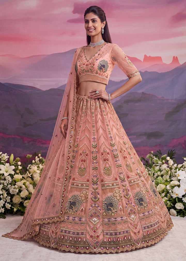 Buy Now Peacock Pattern Motif Peach Designer Wedding Lehenga Choli Online in US, UK, Canada, France, Italy, Germany, Sweden, Denmark, UAE &amp; Worldwide at Empress.