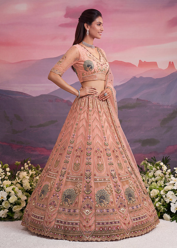 Buy Now Peacock Pattern Motif Peach Designer Wedding Lehenga Choli Online in US, UK, Canada, France, Italy, Germany, Sweden, Denmark, UAE &amp; Worldwide at Empress.