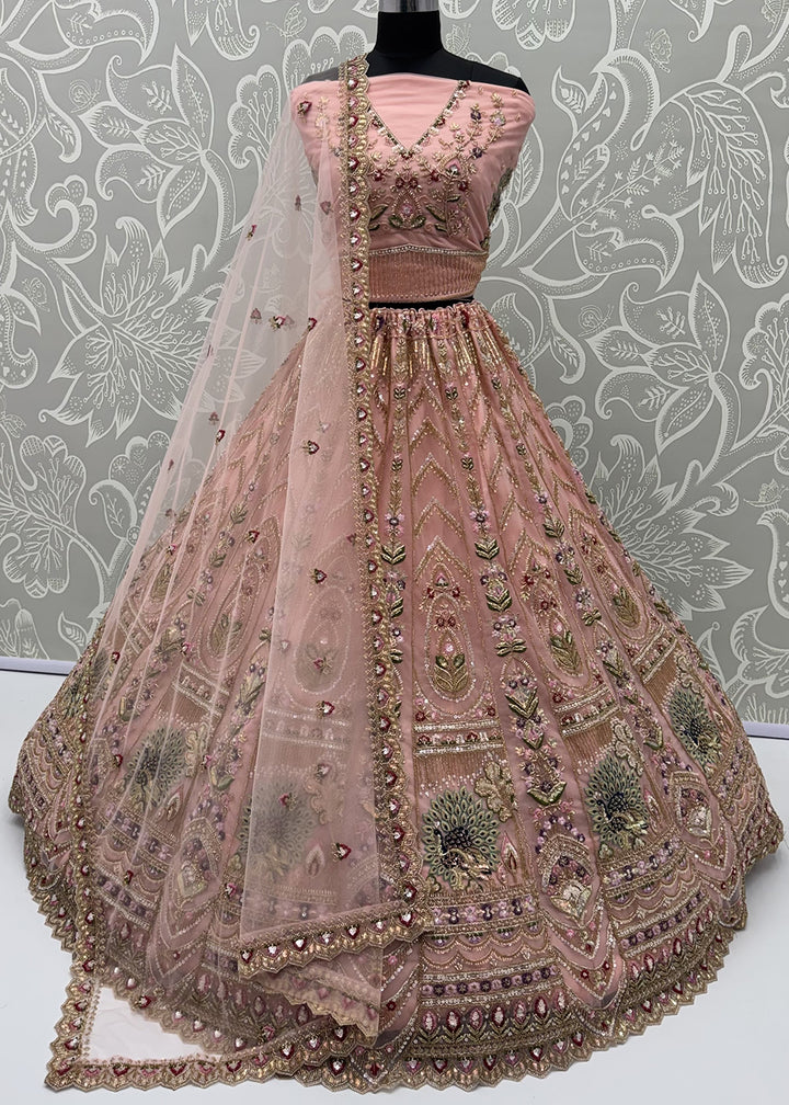 Buy Now Peacock Pattern Motif Peach Designer Wedding Lehenga Choli Online in US, UK, Canada, France, Italy, Germany, Sweden, Denmark, UAE &amp; Worldwide at Empress.