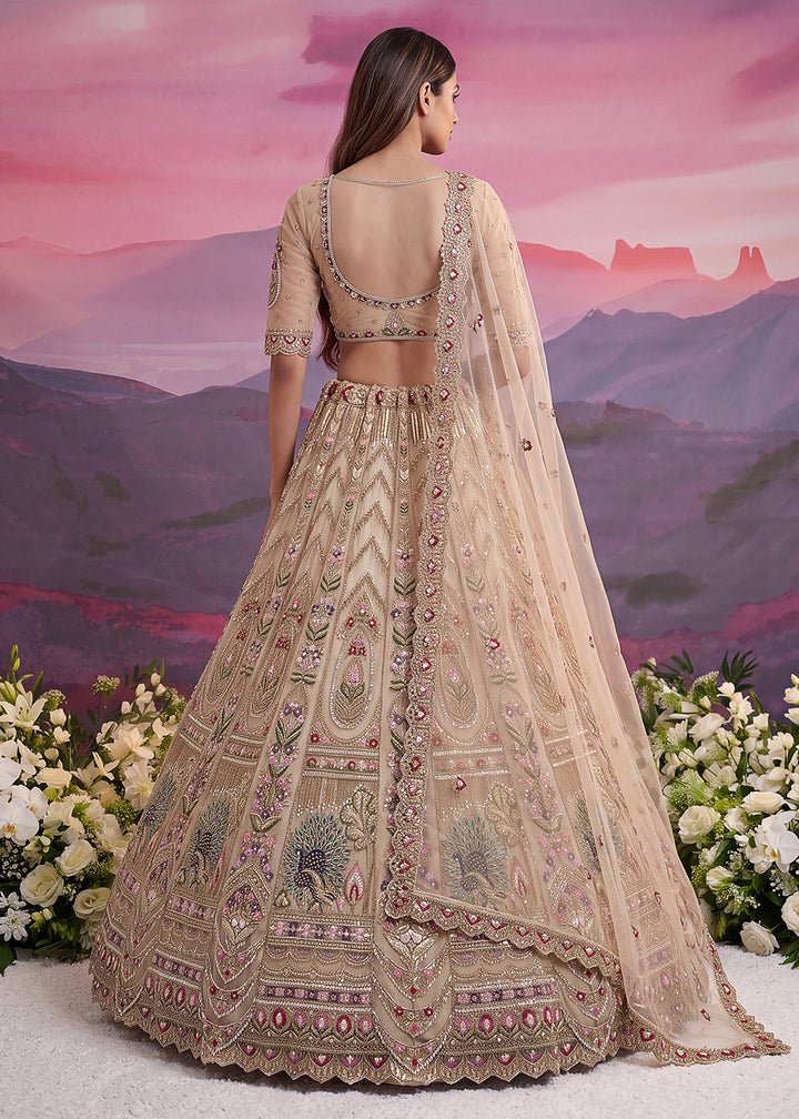 Buy Now Peacock Pattern Motif Beige Designer Wedding Lehenga Choli Online in US, UK, Canada, France, Italy, Germany, Sweden, Denmark, UAE &amp; Worldwide at Empress