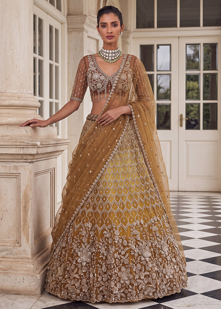 Buy Now Shaded Yellow Premium Net Embroidered Lehenga Choli Online in US, UK, Canada, France, Italy, Germany, Sweden, Denmark, Australia &amp; Worldwide at Empress.