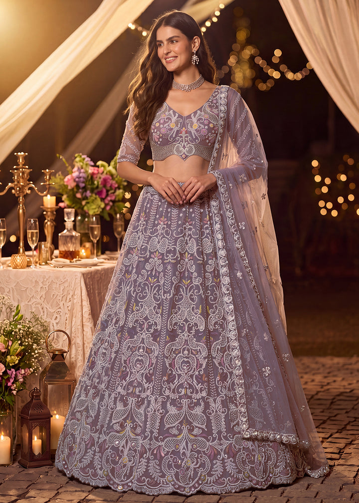 Shop Now Dreamy Lilac Sheer-Sleeve Party Wear Lehenga Choli Online in USA, UK, Canada, France, Germany, Spain, Austria, Sweden, UAE &amp; Worldwide at Empress.