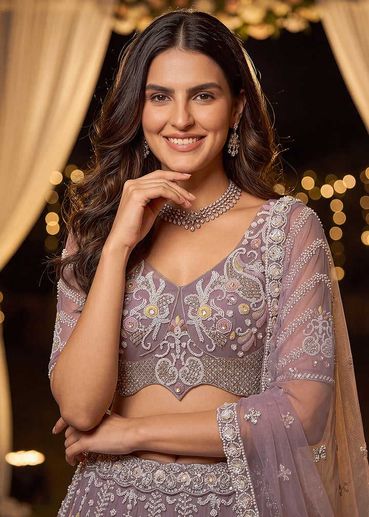 Shop Now Dreamy Lilac Sheer-Sleeve Party Wear Lehenga Choli Online in USA, UK, Canada, France, Germany, Spain, Austria, Sweden, UAE &amp; Worldwide at Empress.