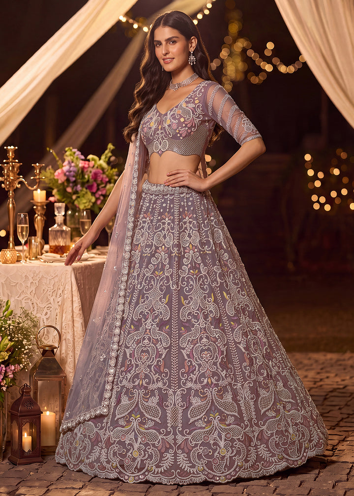 Shop Now Dreamy Lilac Sheer-Sleeve Party Wear Lehenga Choli Online in USA, UK, Canada, France, Germany, Spain, Austria, Sweden, UAE &amp; Worldwide at Empress.