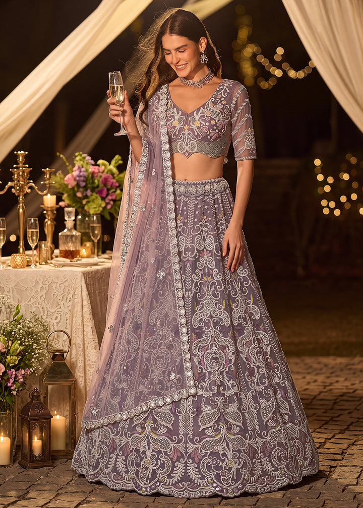 Shop Now Dreamy Lilac Sheer-Sleeve Party Wear Lehenga Choli Online in USA, UK, Canada, France, Germany, Spain, Austria, Sweden, UAE &amp; Worldwide at Empress.