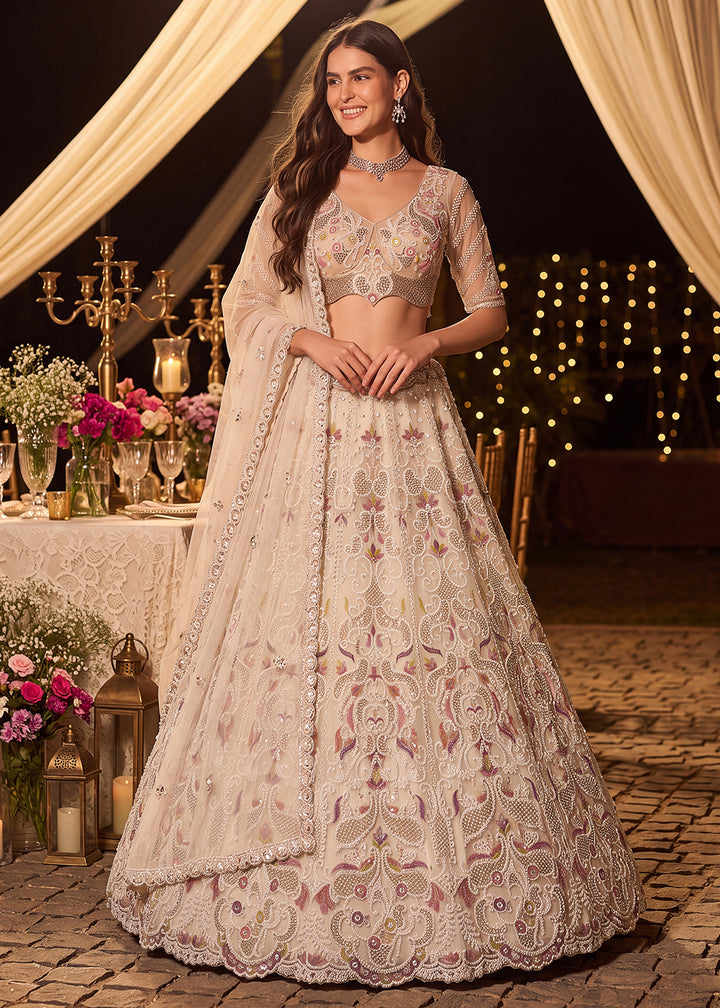 Shop Now Dreamy Cream Sheer-Sleeve Party Wear Lehenga Choli Online in USA, UK, Canada, France, Germany, Spain, Austria, Sweden, UAE &amp; Worldwide at Empress.