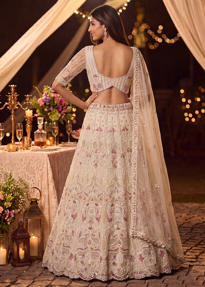 Shop Now Dreamy Cream Sheer-Sleeve Party Wear Lehenga Choli Online in USA, UK, Canada, France, Germany, Spain, Austria, Sweden, UAE &amp; Worldwide at Empress.