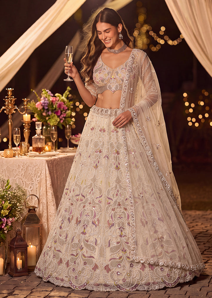 Shop Now Dreamy Cream Sheer-Sleeve Party Wear Lehenga Choli Online in USA, UK, Canada, France, Germany, Spain, Austria, Sweden, UAE &amp; Worldwide at Empress.