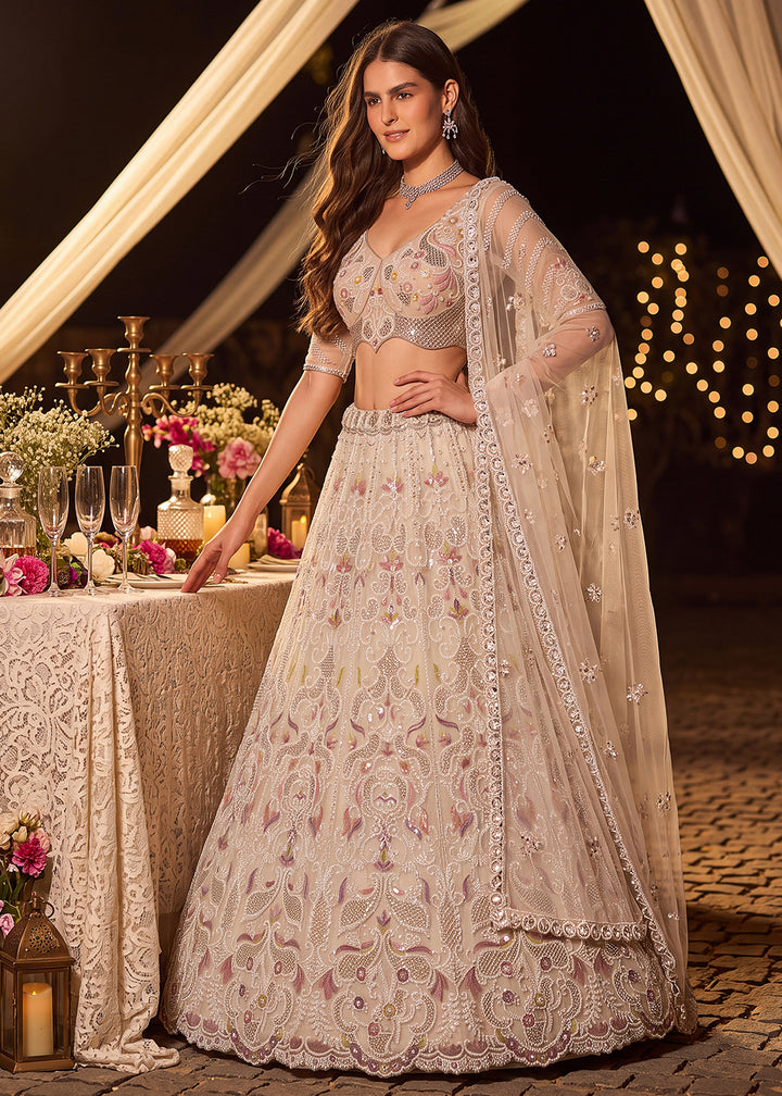 Shop Now Dreamy Cream Sheer-Sleeve Party Wear Lehenga Choli Online in USA, UK, Canada, France, Germany, Spain, Austria, Sweden, UAE &amp; Worldwide at Empress.