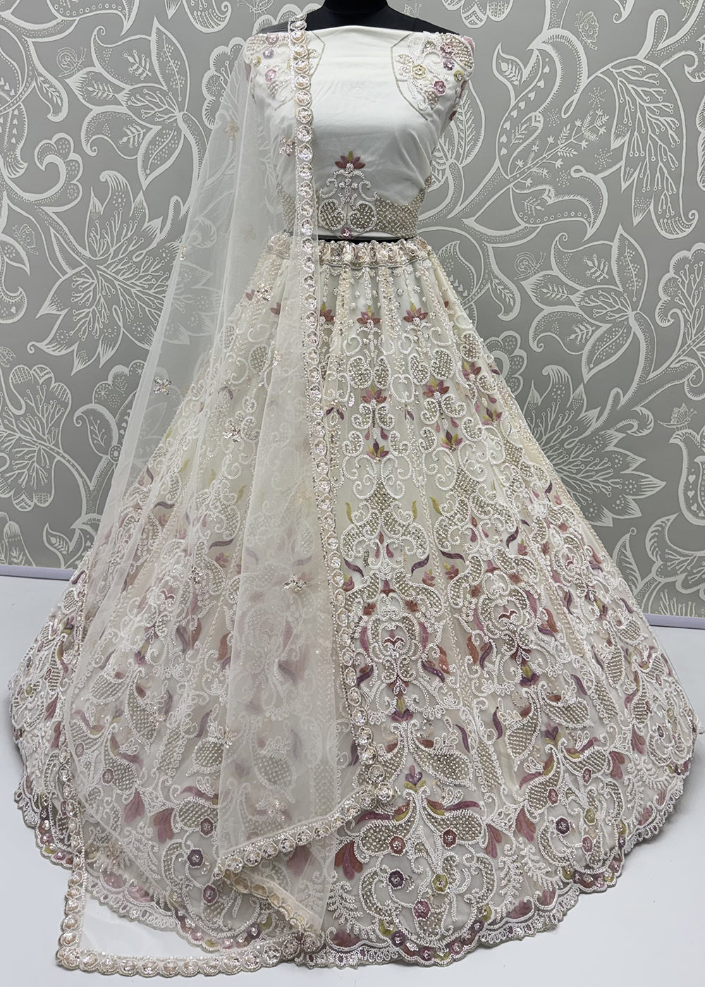 Shop Now Dreamy Cream Sheer-Sleeve Party Wear Lehenga Choli Online in USA, UK, Canada, France, Germany, Spain, Austria, Sweden, UAE &amp; Worldwide at Empress.