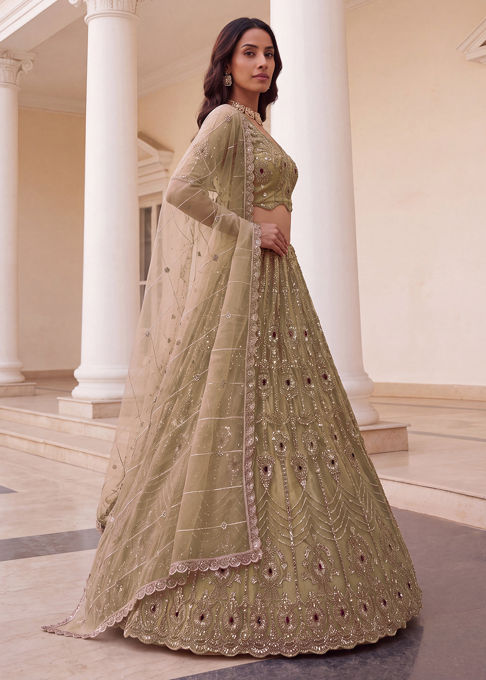 Shop Now Eye-catchy Chiku Ruby Stone Work Wedding Lehenga Choli Online in USA, UK, Canada, France, Germany, Austria, Australia, Italy &amp; Worldwide at Empress.