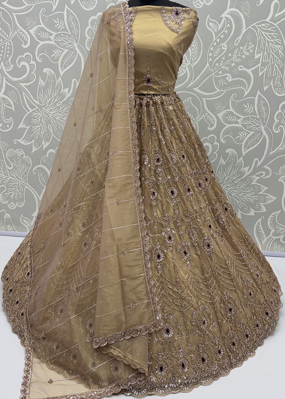 Shop Now Eye-catchy Chiku Ruby Stone Work Wedding Lehenga Choli Online in USA, UK, Canada, France, Germany, Austria, Australia, Italy &amp; Worldwide at Empress.