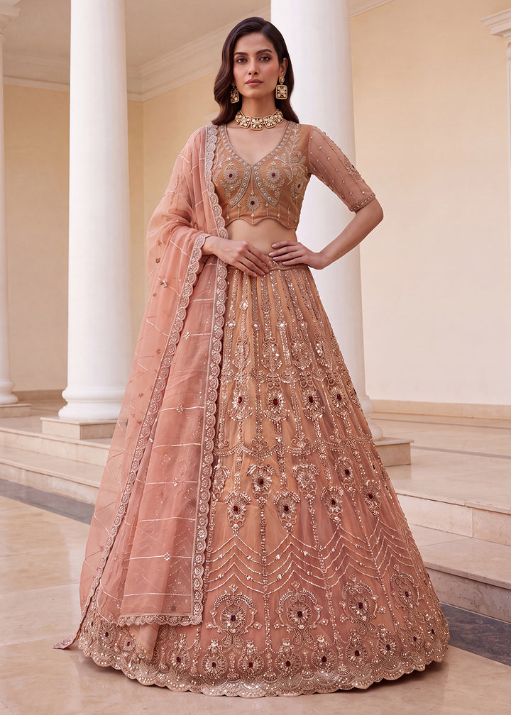 Shop Now Eye-catchy Peach Ruby Stone Work Wedding Lehenga Choli Online in USA, UK, Canada, France, Germany, Austria, Australia, Italy &amp; Worldwide at Empress.