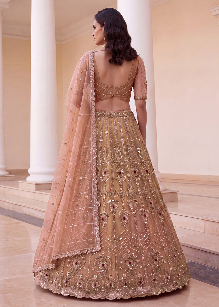 Shop Now Eye-catchy Peach Ruby Stone Work Wedding Lehenga Choli Online in USA, UK, Canada, France, Germany, Austria, Australia, Italy &amp; Worldwide at Empress.