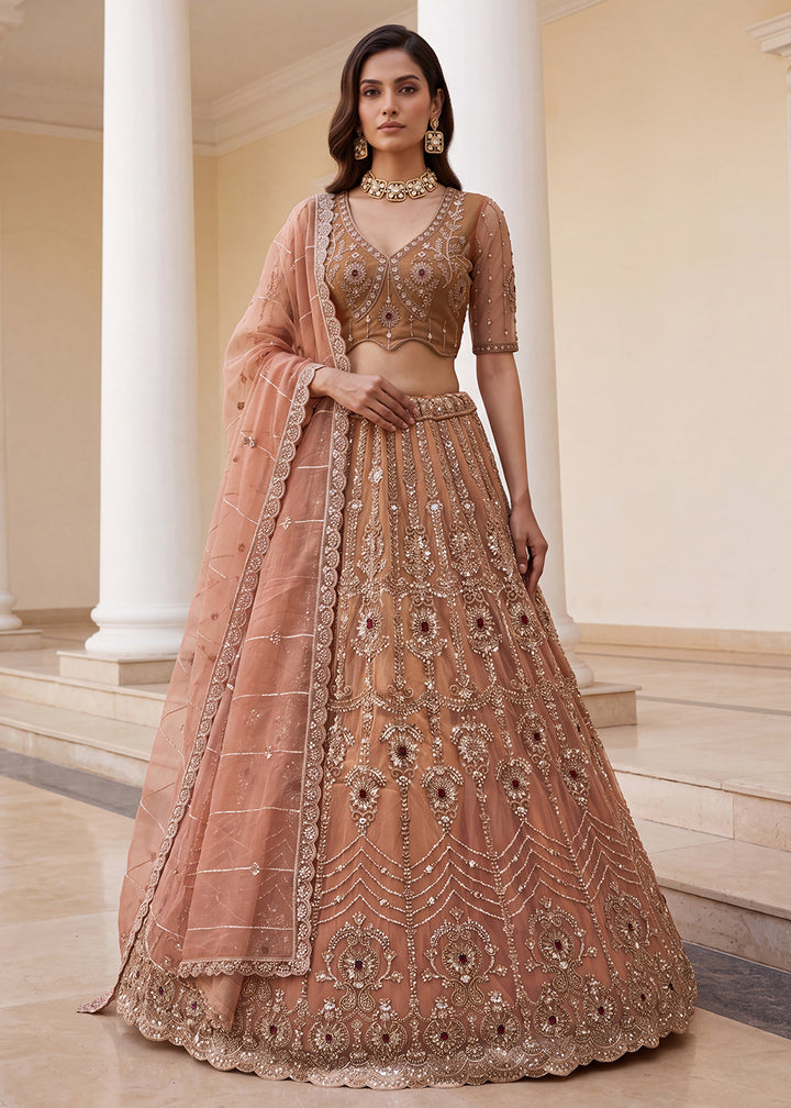 Shop Now Eye-catchy Peach Ruby Stone Work Wedding Lehenga Choli Online in USA, UK, Canada, France, Germany, Austria, Australia, Italy &amp; Worldwide at Empress.