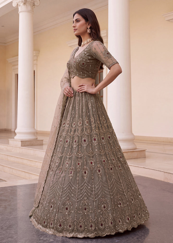 Shop Now Eye-catchy Beige Ruby Stone Work Wedding Lehenga Choli Online in USA, UK, Canada, France, Germany, Austria, Australia, Italy &amp; Worldwide at Empress.