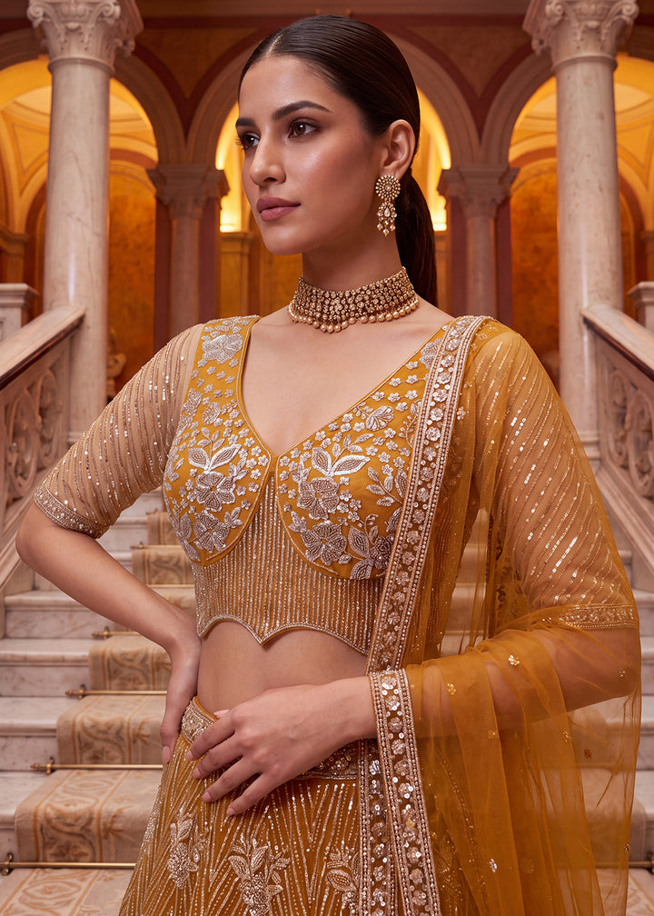 Shop Breathtaking Yellow Heavy Embroidery Reception Party Lehenga Choli Online in USA, UK, Canada, France, Germany, Spain, Austria, UAE &amp; Worldwide at Empress.